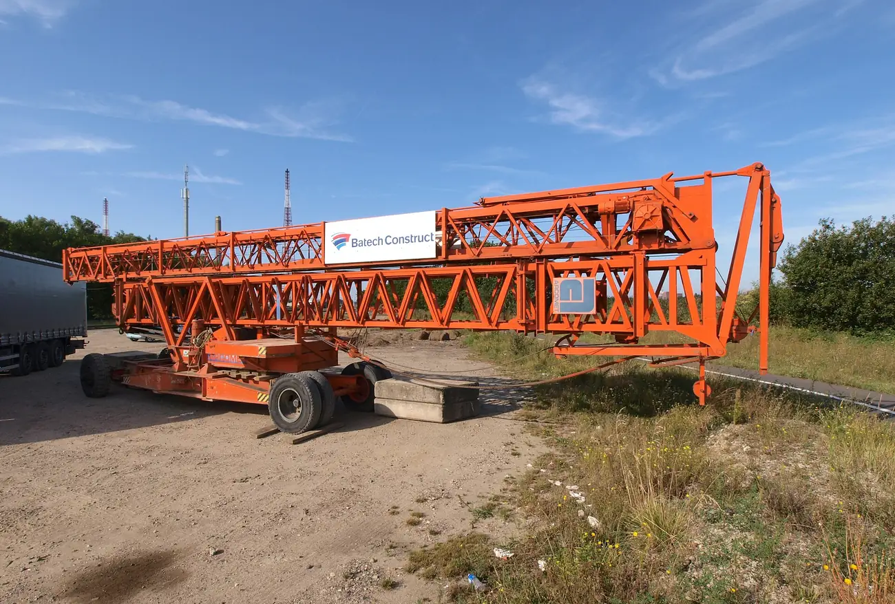 Mobile crane with its boom raised on a work site